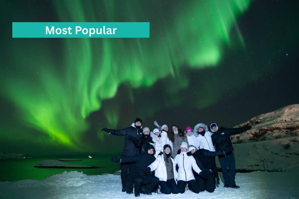 Home - Experience Tromsø Like a Local Group of tourists watching the Northern Lights on a bus tour from Tromsø